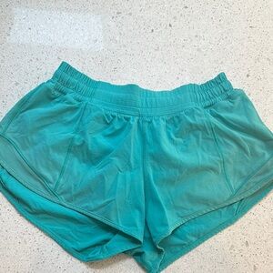 Women's Lululemon Teal athletic Shorts with mesh side panels, sz 4 reg.